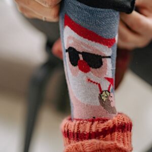 Man Pulling Up Funny Socks